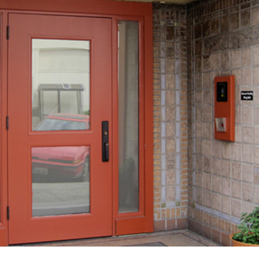 An entry door with intercom and card access