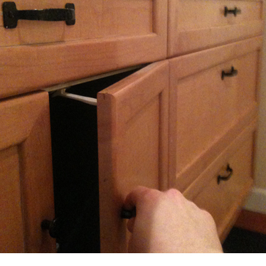 A cabinet with childproof latch