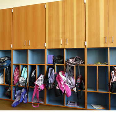 A wall of storage cabinets for kids and adults