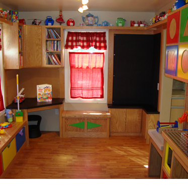 A kid-sized play area adjacent to a kitchen